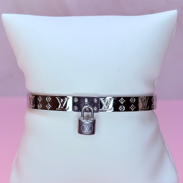 silver "LV" bangle