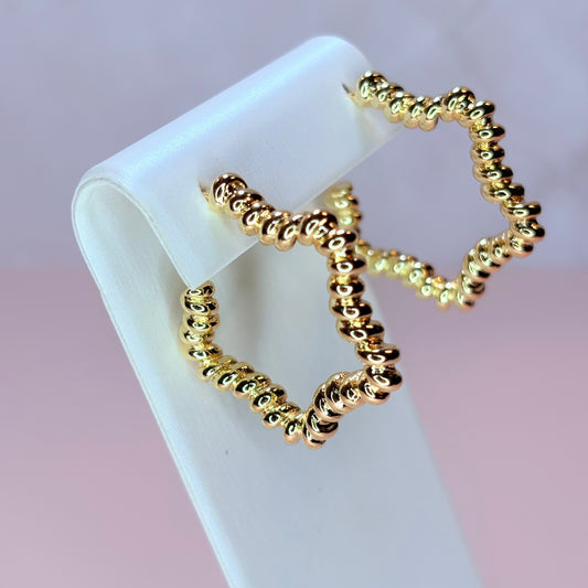 west star hoop-style earrings