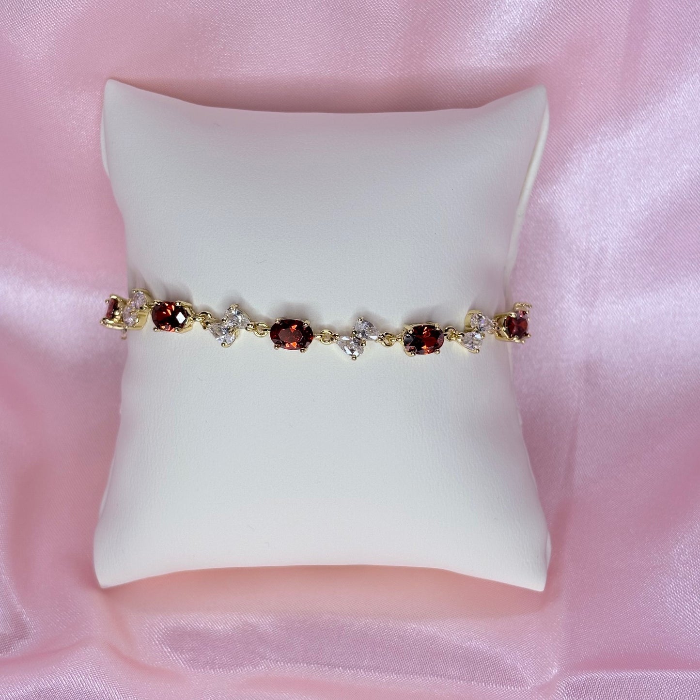 clear bow with red bracelet
