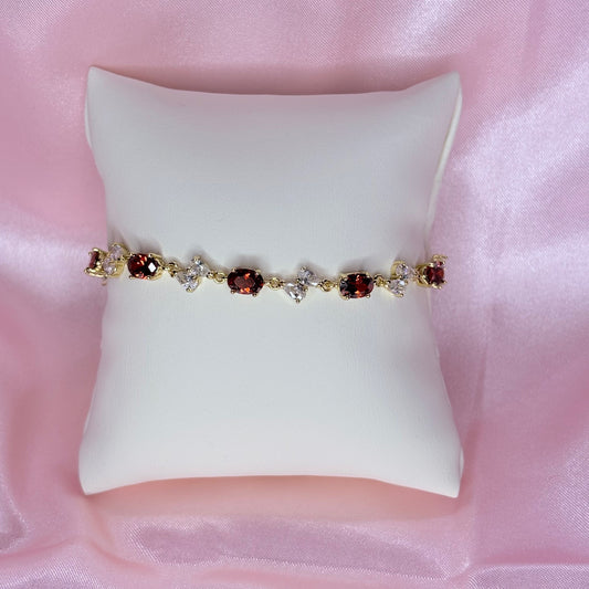 clear bow with red bracelet