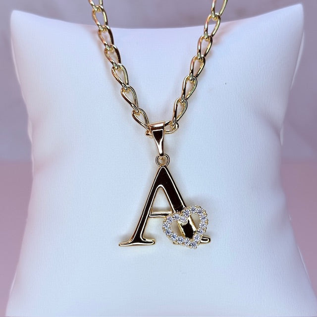 gold initial with pave heart