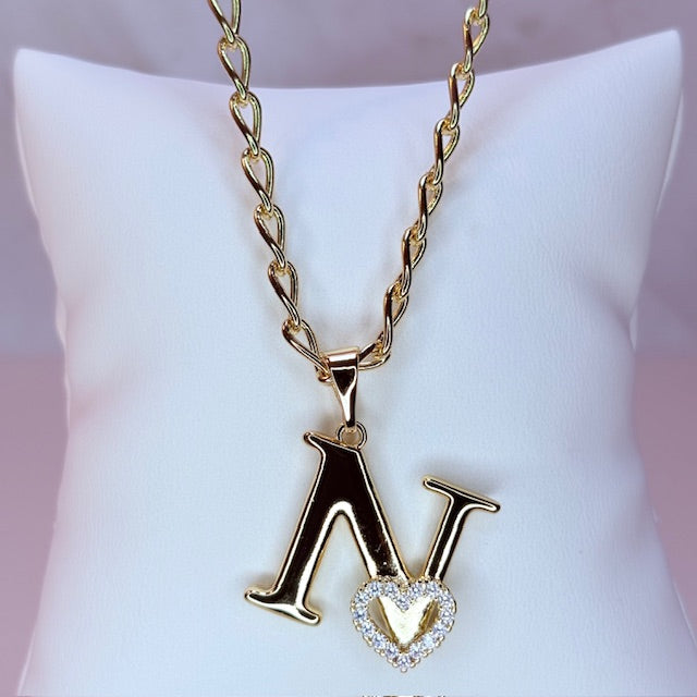gold initial with pave heart