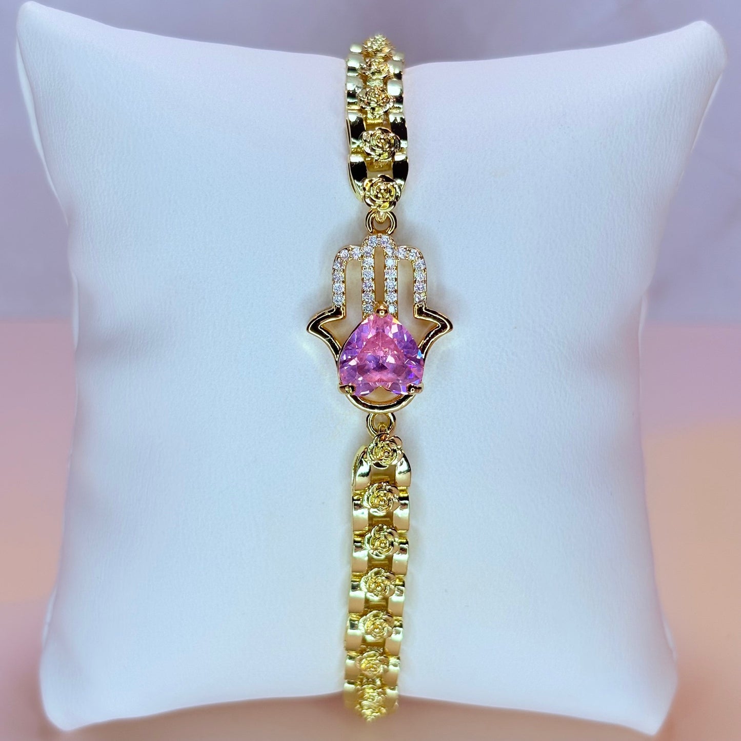 hand of fatima with pink heart bracelet