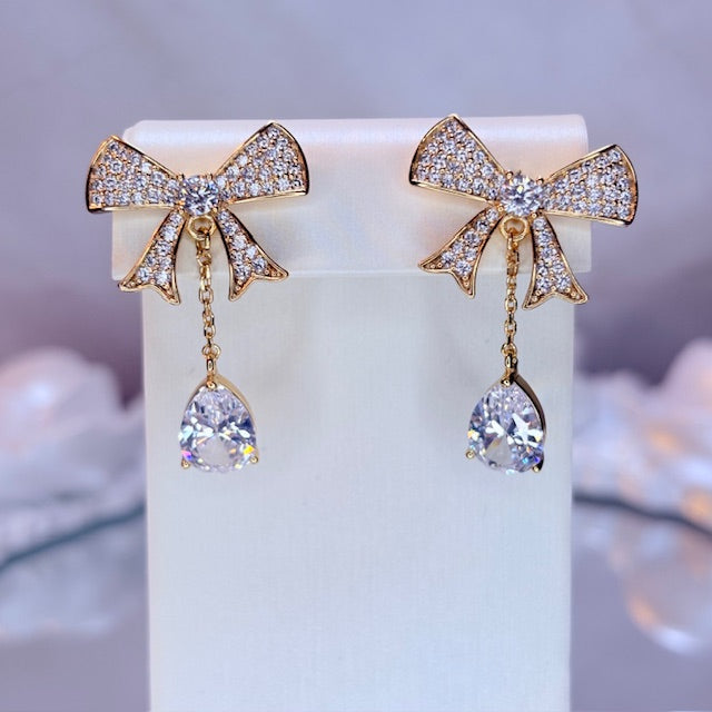 radiant bow drop earrings