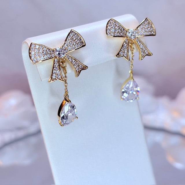radiant bow drop earrings