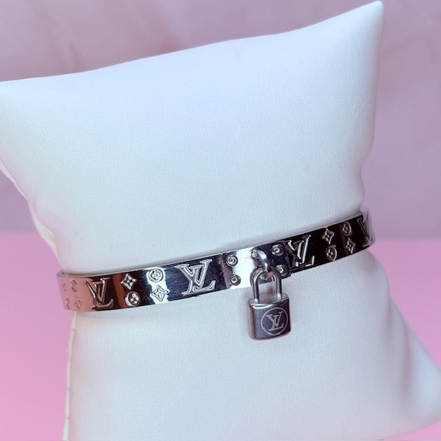 silver "LV" bangle