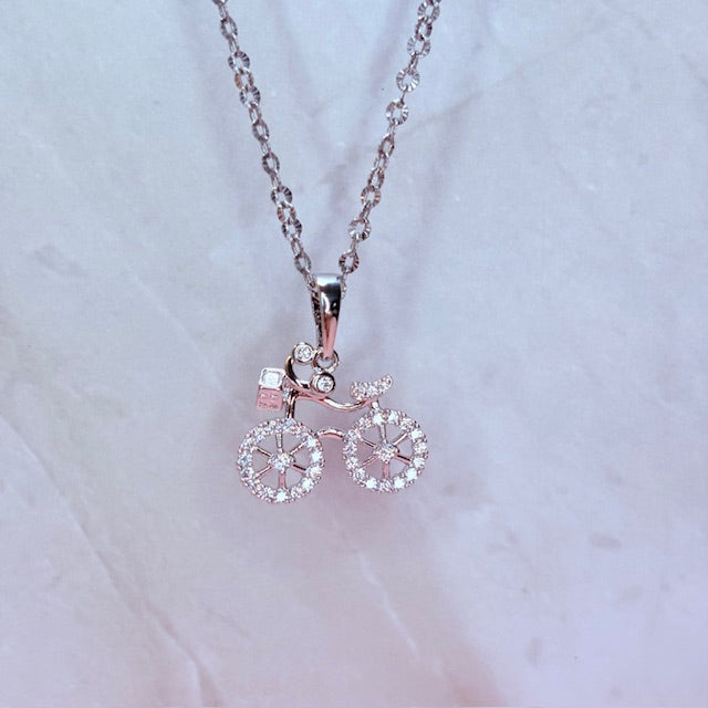 silver sparkle bicycle necklace